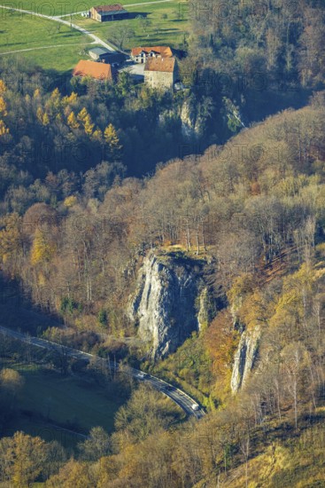 Aerial view, Reckenhöhle dripstone cave in the autumnal forest in the district Volkringhausen in