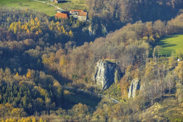 Aerial view, Reckenhöhle dripstone cave in the autumnal forest in the district Volkringhausen in