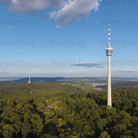 High television tower above lush greenery, soft clouds in the clear sky, Stuttgart-Degerloch,