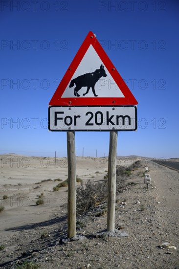 Sign warning of brown hyenas or beach wolves (Parahyaena brunnea), near Lüderitz, Karas Region,