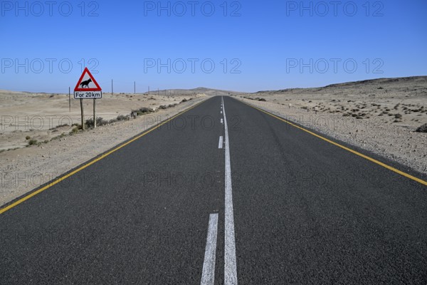 Sign warning of brown hyenas or beach wolves (Parahyaena brunnea), near Lüderitz, Karas Region,