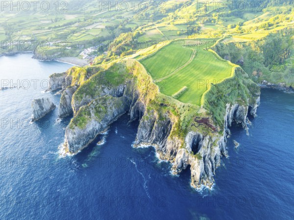 Cape Furado, Cliffs, Green Lush Fields, Pasturelands and Atlantic Ocean on Sunny Morning. Azores,