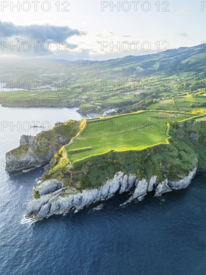 Cape Furado, Cliffs, Hills, Green Lush Fields, Pasturelands and Atlantic Ocean on Sunny Morning.