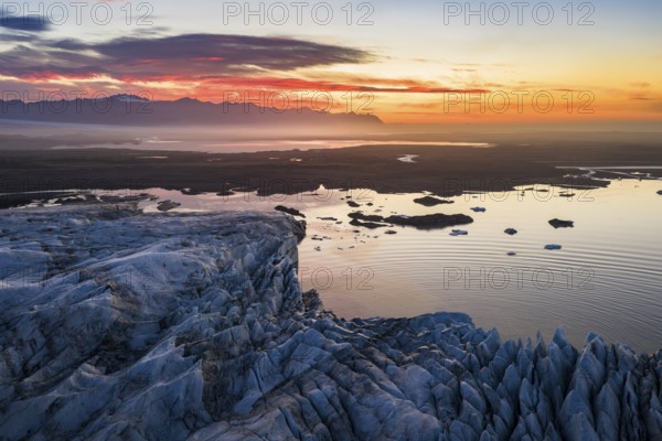 Glacier with Fjallsarlon glacier lagoon at sunrise, Vatnajökull National Park, South Iceland,