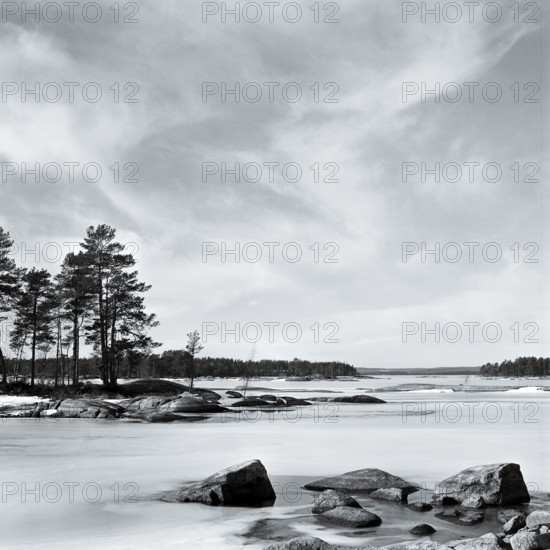 Lake Stora Gla in winter, frozen, with rocks and islands, black and white, analogue, Värmland,