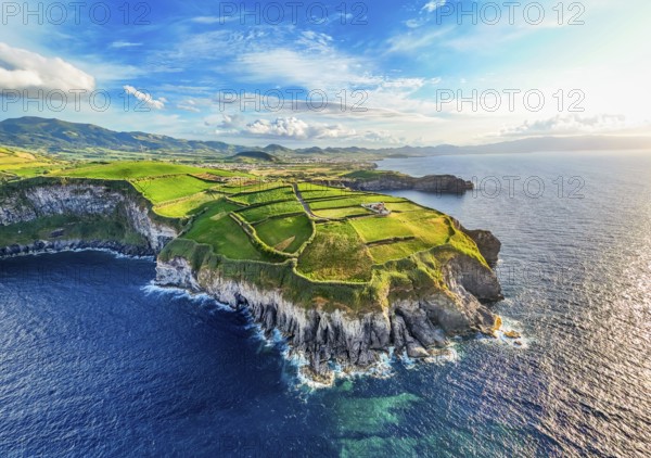Panorama of Cape Cintrao, Cliffs, Green Hills, Fields with Pasturelands and Atlantic Ocean. Azores,