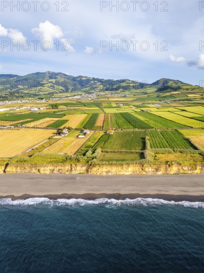 Santa Barbara Beach, Green Lush Fields with Pasturelands and Atlantic Ocean. Mountains on