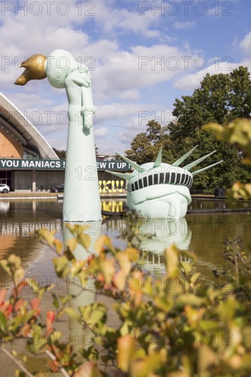 Symbolisation of a Statue of Liberty submerged in water in front of the Haus der Kulturen der Welt