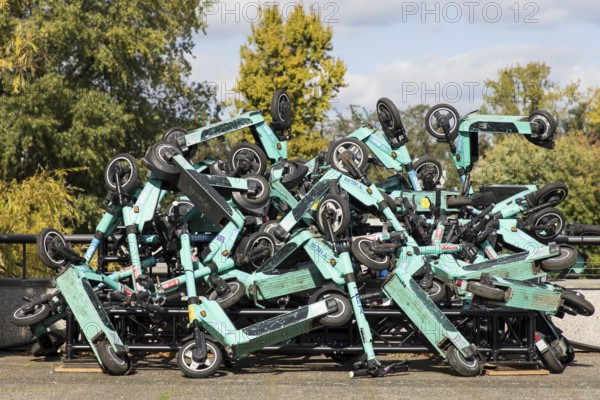 E-scooters stacked on top of each other are on display on the roof terrace of the Haus der Kulturen