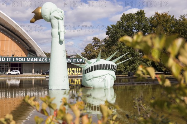 Symbolisation of a Statue of Liberty submerged in water in front of the Haus der Kulturen der Welt