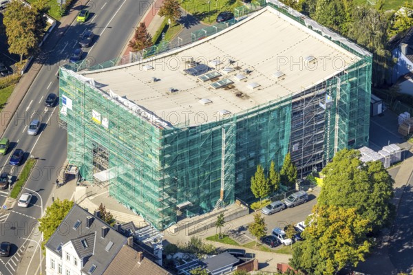 Aerial view, Hamm Municipal Music School, covered building and construction site with new building,
