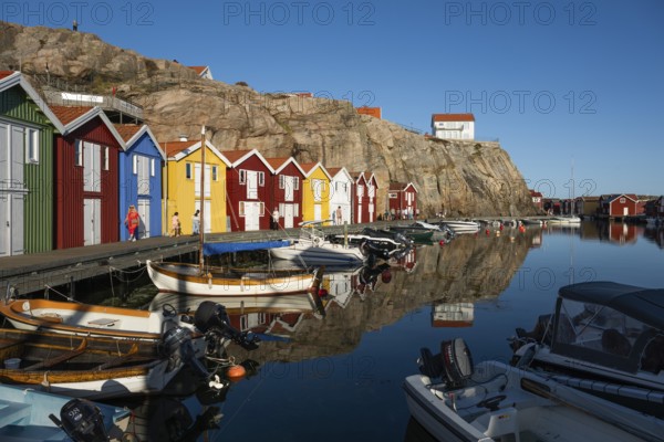 Boats and colourful boathouses in the harbour of Smögen, Smögenbryggan, Västra Götalands Län,