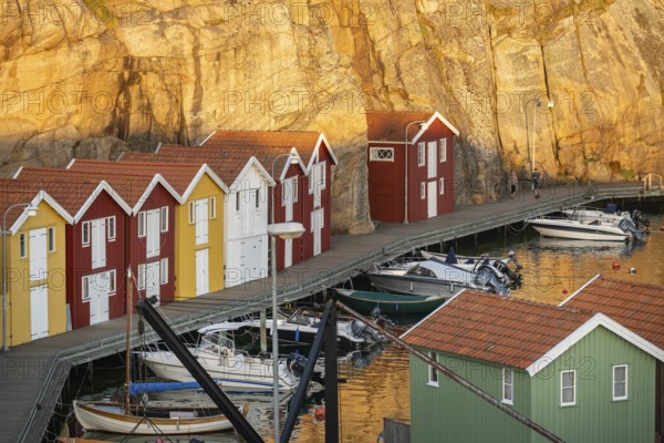 Colourful boathouses and boats in the harbour of Smögen, evening mood, Smögenbryggan, Västra