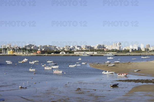 View over the mouth of the river Arade with fishing boats to Portimao, Ferragudo, Algarve, Portugal