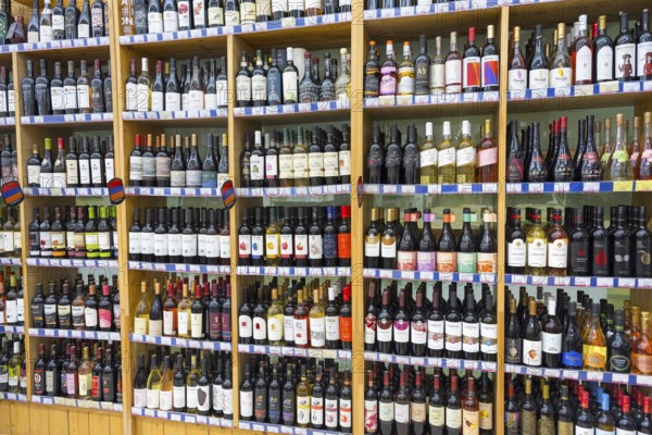 A large shelf filled with different bottles of wine in a shop, Gntunik supermarket, Aragazotn