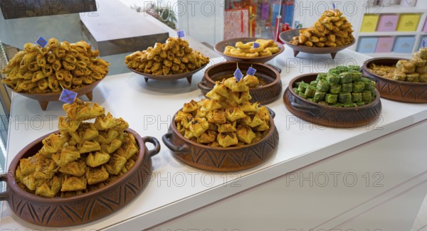 Traditional sweets arranged in decorative bowls in a display, Gntunik supermarket, Aragazotn