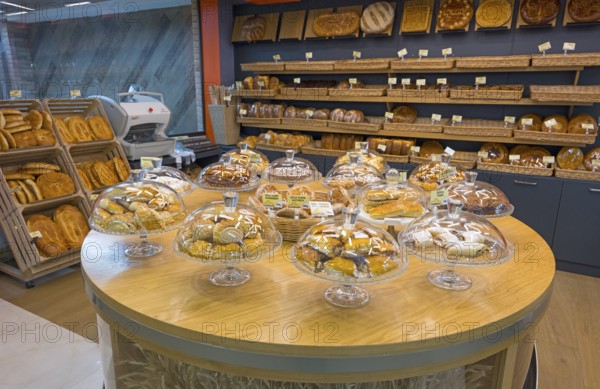 Various pastries and breads are decoratively displayed in a bakery, Gntunik supermarket, Aragazotn
