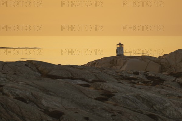 Small lighthouse at sunset, archipelago, Smögen, Smögenbryggan, Västra Götalands Län, Bohuslän,