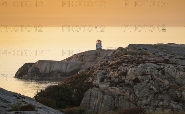 Small lighthouse at sunset, archipelago, Smögen, Smögenbryggan, Västra Götalands Län, Bohuslän,