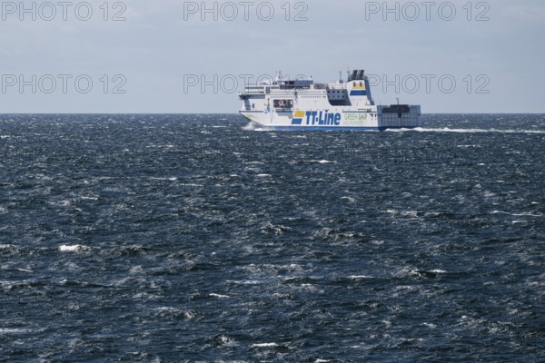 LNG-powered TT-Line ferry travelling across a gently moving blue sea, near Warnemünde, Rostock,