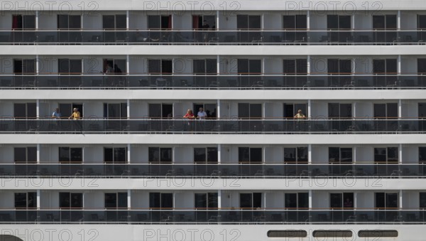 Detailed view of balconies of a cruise ship with passengers, Warnemünde, Rostock,