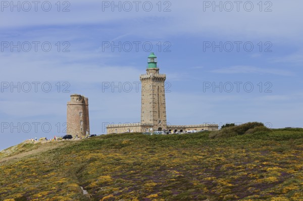 Lighthouse and landscape with flowering gorse (Ulex gallii) and heather, Cap Frehel, Cote