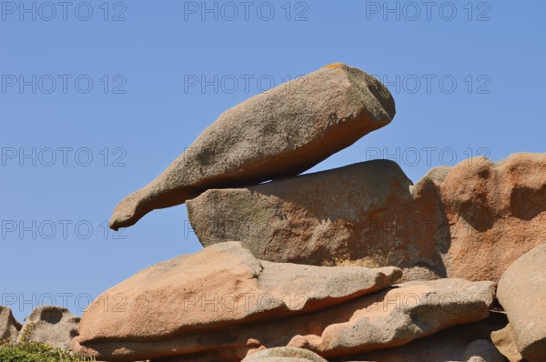 Granite rock in the shape of a bottle on the Cote de Granit Rose coast near Ploumanac'h,