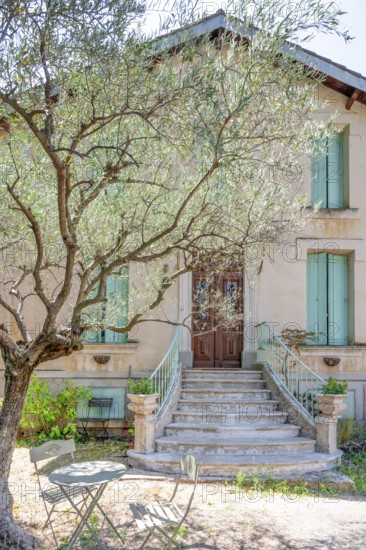 Typical Midi architecture in the south of France: a rustic stone staircase with ornate banisters
