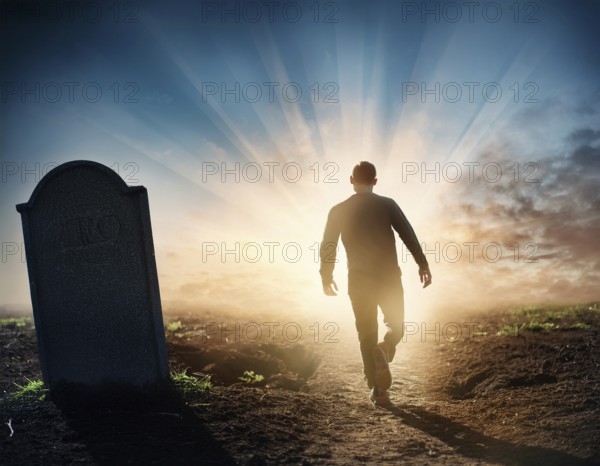 A silhouette of a lone figure walking off a gravestone, The scene evokes Resurrection thoughts