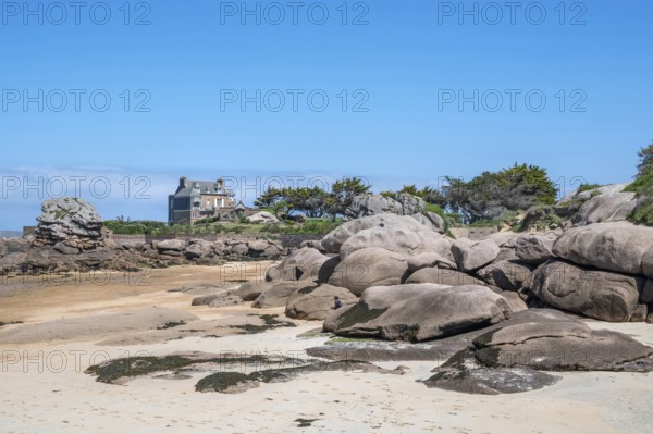 View from the harbour beach of Trégastel on the Côte de Granit Rose at low tide over the iconic