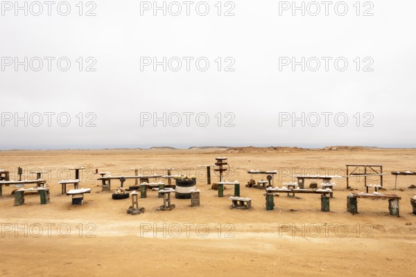 Pink salt displayed on wooden stands along the road to Namib-Naukluft National Park and Sandwich