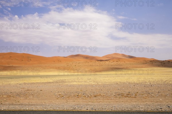 Sossusvlei in Namibia is a desert wonder, famous for its giant red dunes, glowing at sunrise and
