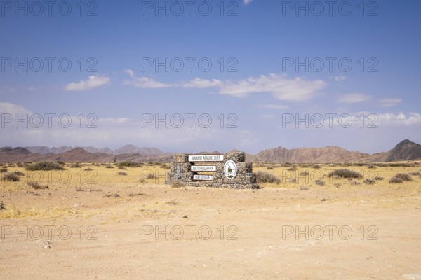 Stone entrance sign of Namib-Naukluft National Park in Namibia- 27 August, 2025: surrounded by