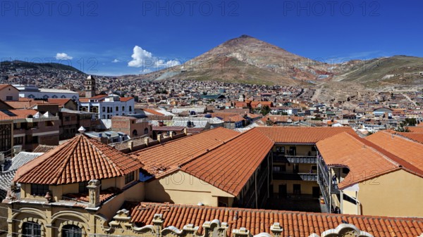 Red tiled roofs with a mountain view in the background on a clear day, the Cerro Rico silver