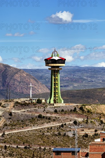 Large observation tower on a hill with sweeping views of the mountains and sky, the water tower of