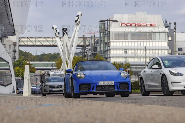 Porscheplatz with Porsche headquarters. Inspiration 911 artwork by Gerry Judah: three steles, each
