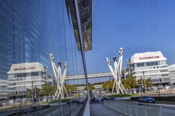 Porscheplatz with Porsche headquarters. Inspiration 911 artwork by Gerry Judah: three steles, each