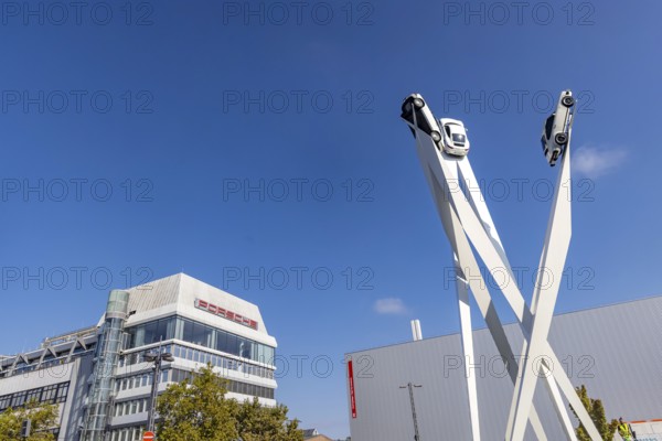 Porscheplatz with Porsche headquarters. Inspiration 911 artwork by Gerry Judah: three steles, each