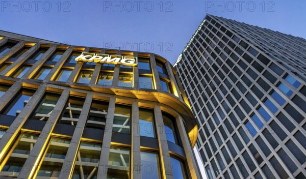 The picture shows modern office and commercial buildings at the central station, KPMG and Total