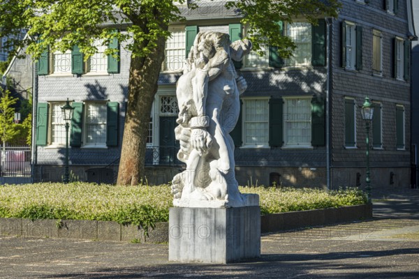 Detailed statue in front of a historic building with clear lines and soft shadows, statue The