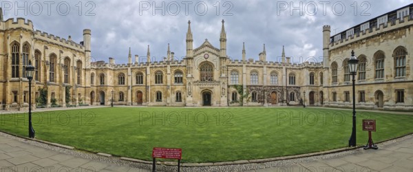 The University of Cambridge panoramic view of a historic college courtyard, featuring a grand,