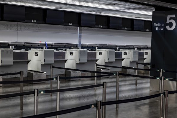 Illuminated and Empty Airport Check in Counter in Zurich Airport at Night in Kloten, Zurich, Zurich