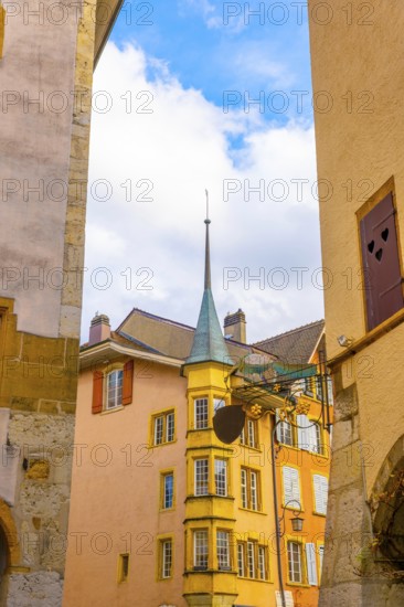 Old Town with Corner House with Tower and Sky and Clouds in a Sunny Autumn Day in City of Biel,