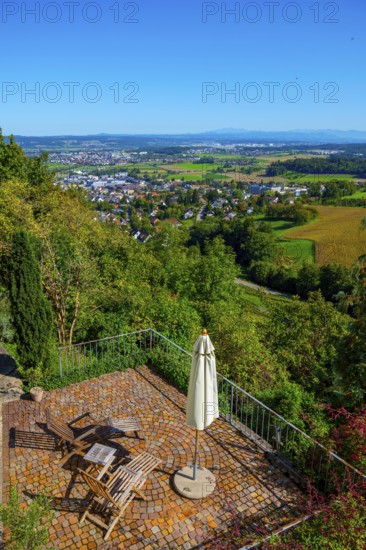 Panoramic View over City and Landscape with a Terrace with Chair and Parasol From Medieval Old Town