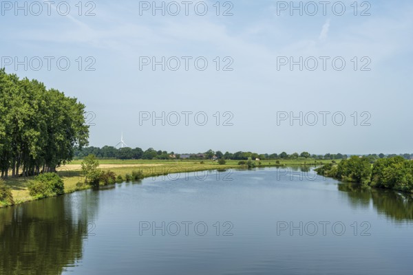 Tranquil river landscape with trees and blue sky, Weser, Groß Hutbergen, Verden, Lower Saxony,