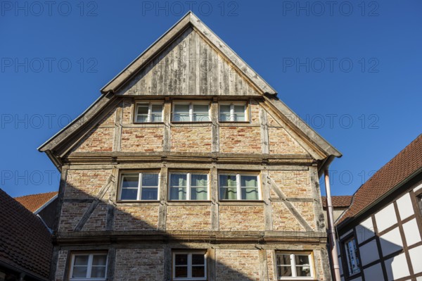 Large half-timbered house under a blue sky, representing traditional architecture, Warendorf,