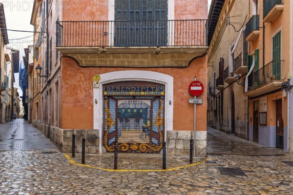 Mural painting on a jalousie to a street corner restaurant in the old town of Palma, Palma de