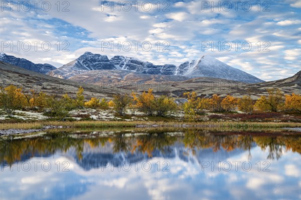 Autumn landscape in Rondane National Park, mountains Høgronden, Midtronden and Digerronden Dørålen,