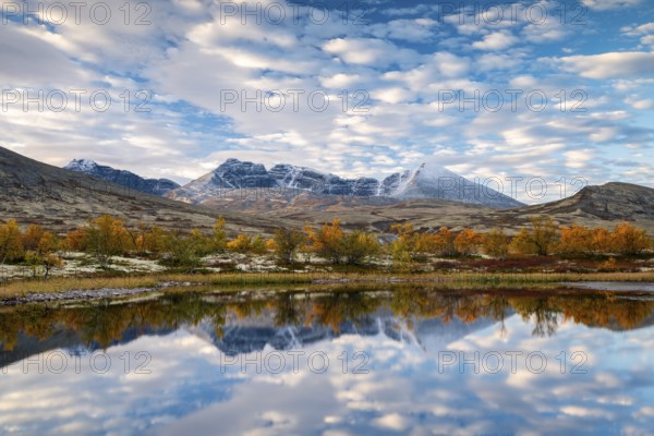 Autumn landscape in Rondane National Park, mountains Høgronden, Midtronden and Digerronden Dørålen,