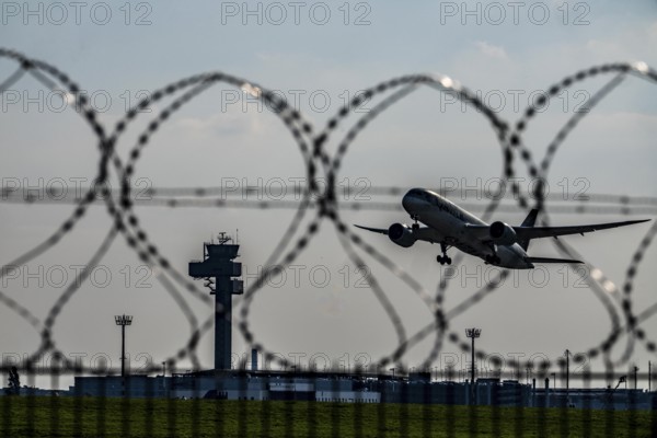 Symbolic image security at the airport, outer fence at Düsseldorf International Airport, steel wire
